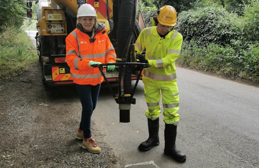 Council Leader helping to fill in potholes